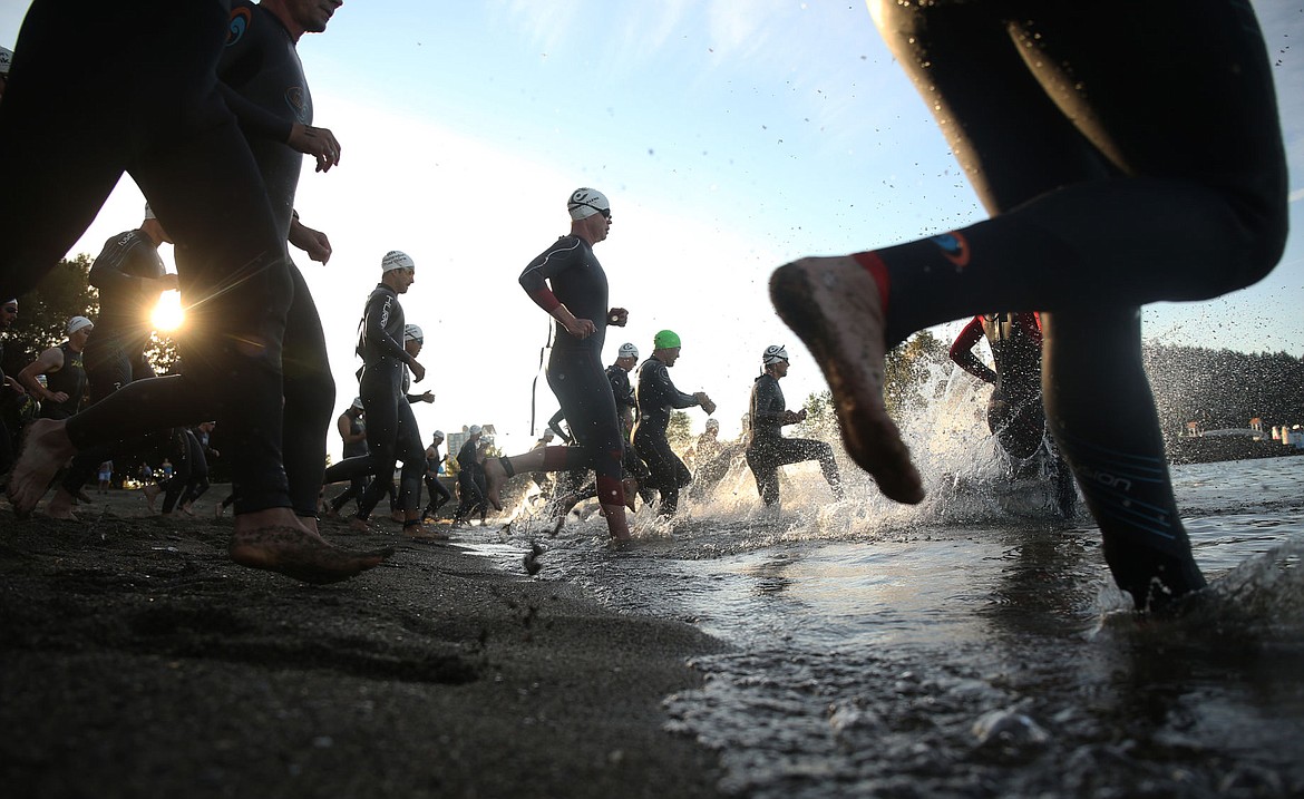 &lt;p&gt;LOREN BENOIT/Press Individuals rush into the waters of Lake Coeur d'Alene from the starting line of the Coeur d'Alene Triathlon Saturday morning at City Beach.&lt;/p&gt;