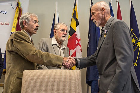 &lt;p&gt;Retired U.S. Army Colonel Ronald Leonard, right, and retired U.S. Army Major Larry Moore, center, congratulate Silver Star Medal recipient Michael Atwell at Atwell's Silver Star Medal ceremony Wednesday at the American Legion Post 143 in Post Falls.&lt;/p&gt;