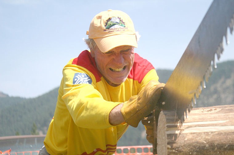 &lt;p&gt;Dan Handlin of Marion, MT struggles to saw a chunk off a log during the Huckleberry Homesteader Pentathlon. The Huckleberry Festival was held last weekend in Trout Creek attracting thousands of people from around the region.&lt;/p&gt;