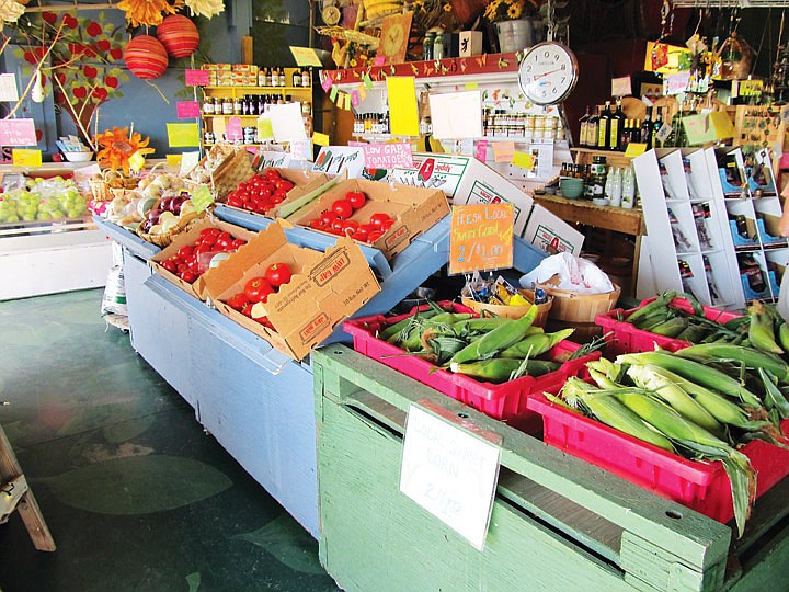 White Trail Farm Market (originally known as White Trail Produce) shows off fresh produce for sale. Produce for sale includes many organic fruits and vegetables. The stand is located 4 miles west of Quincy on Highway 28.