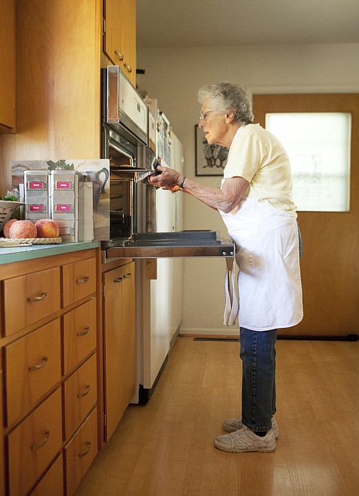 &lt;p&gt;Irene Houston checks on the crust of what will be a peach
pie.&lt;/p&gt;