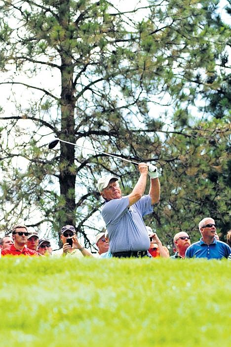 Jack Nicklaus was up to his old tricks, wowing galleries with his golf play as he putts the ball into the cup on the first hole of the Idaho Club, located near Hope, Idaho, on Wednesday, Aug. 13, 2008, afternoon as the golf course was officially unveiled. (Photo by ERIC PLUMMER)