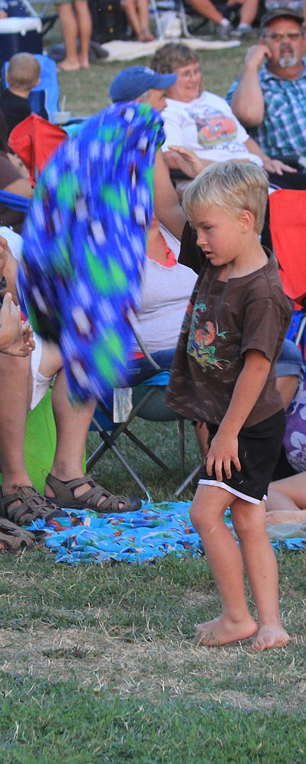 &lt;p&gt;Mason, 5, of Polson, spins a blanket during a break at the Bop-A-Dips concert Saturday at Riverside Park.&lt;/p&gt;