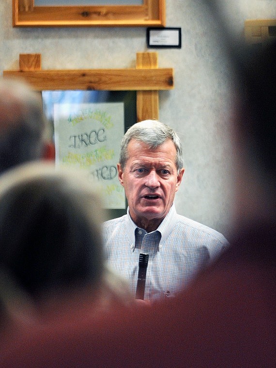 Sen. Max Baucus (D-Mont.) speaks to a crowd of about 50 people while a line forms to engage the Congressman. The audience offered a wide array of questions and comments, ranging from the state of the economy to health care on Friday at Glacier Discovery Square in Columbia Falls.