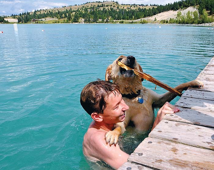 Buck tries to climb out of the water on the shoulders of Troy Fraley, 15, at Foy&#146;s Lake Tuesday.