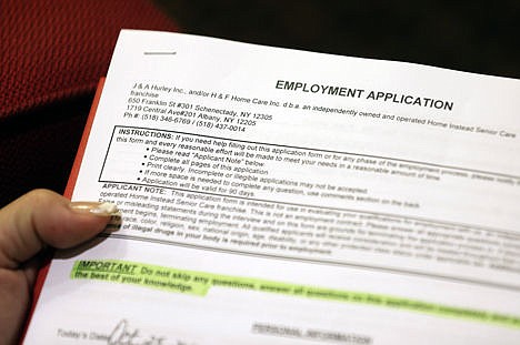 &lt;p&gt;Carmen Nazario of Albany, N.Y., fills out an employment application during a job fair at the Marriott Hotel in Colonie, N.Y., Oct. 25, 2012.&lt;/p&gt;