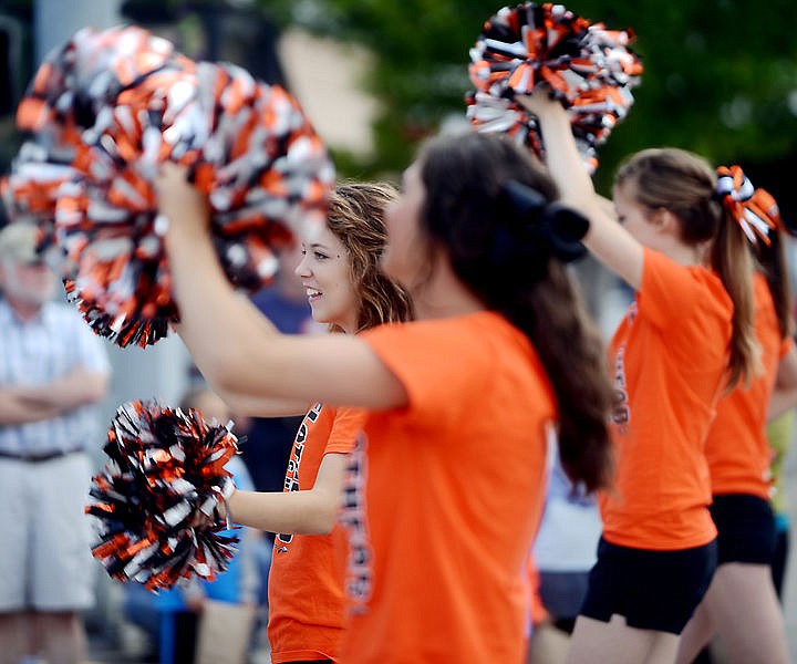 &lt;p&gt;Flathead senior Kailey Spain, center, other cheer leaders make their way down Main Street at the Northwest Montana Fair Parade on Friday morning, August 15, in downtown Kalispell. (Brenda Ahearn/Daily Inter Lake)&lt;/p&gt;