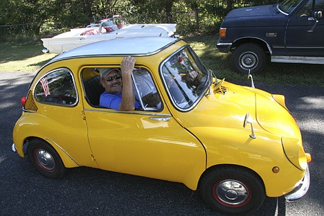 &lt;p&gt;Wayne Lacy, of Rathdrum, smiles in his 1968 Subaru, which was in Saturday's Athol Daze parade. It's small, but it gets great gas mileage.&lt;/p&gt;