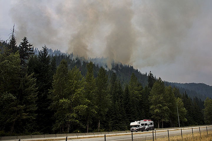 &lt;p&gt;&#160;Smoke emanates from a fire in a heavily wooded area Friday near Interstate 90 and Fourth of July Pass.&lt;/p&gt;