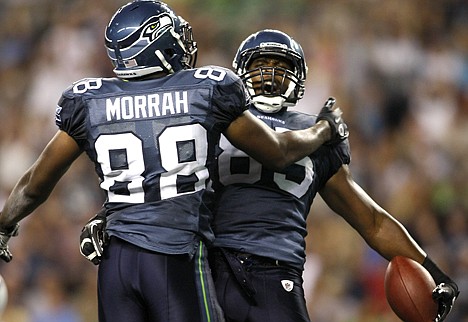 &lt;p&gt;Seattle's Anthony McCoy is congratulated by Cameron Morrah (88) after scoring a touchdown in the second half Saturday night. The Seahawks defeated the visiting Tennessee Titans 20-18 in the preseason opener for both teams.&lt;/p&gt;