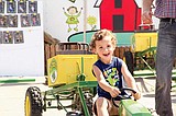 All smiles at the kids' tractor pull
