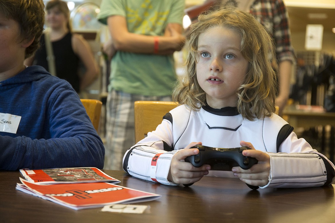 &lt;p&gt;LOREN BENOIT/Press Dressed as a stormtrooper, Leo Adira of Post Falls plays Mario Kart during Coeur d'Con on Saturday at the Coeur d'Alene Public Library.&lt;/p&gt;