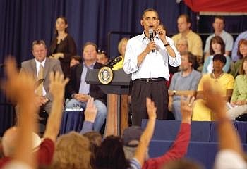 President Barack Obama takes a question during a town hall meeting on health care reform. Jae C. Hong/Associated Press