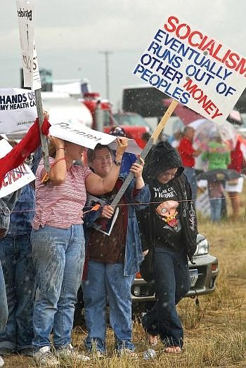 Protesters are lined up outside the airport as President Barack Obama arrives on Air Force One for a town hall meeting about health care in Belgrade Friday. Photo by Mike Albans/Associated Press