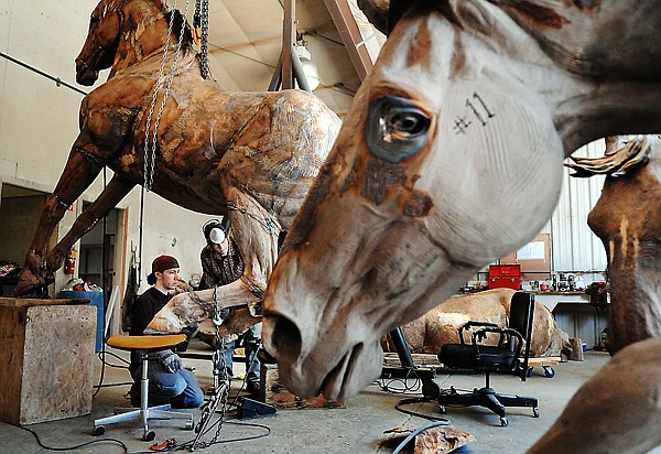 &lt;p&gt;From left, Jeff Stephan and Harvey Fairchild work on one fifteen
life and a quarter bronze horses on Monday afternoon at Kalispell
Art Casting.&#160; Jeff Stephan is the lead welder on the project. He's
been with KAC for seven years. According to Stephan these
sculptures come to him in 40 to 50 pieces. Once they are welded
together Stephan will begin chasing in the details. The horses are
the work of Canadian artists Robert Spaith and Rich Roenisch, both
of Longview, Alberta. When complete the sculpture, On the Banks of
the Bow, will be a permanent fixture at the Calgary Stampede. The
fifteenth and final sculpture is due at the foundry this month.
Kalispell Art Casting got involved with the project in April of
2008. They did an estimate of the amount of bronze that would be
needed to complete the sculpture and came up with 16,000 pounds.
Eight tons of bronze. This is the biggest project the KAC has ever
done. The first piece arrived at the foundry in March of 2009. If
they finish all the pieces this year the project will have taken
almost three years. The project is expected to wrap up this year.
The completed sculpture will be able to be viewed in 2012 at the
Calgary Stampede.&lt;/p&gt;