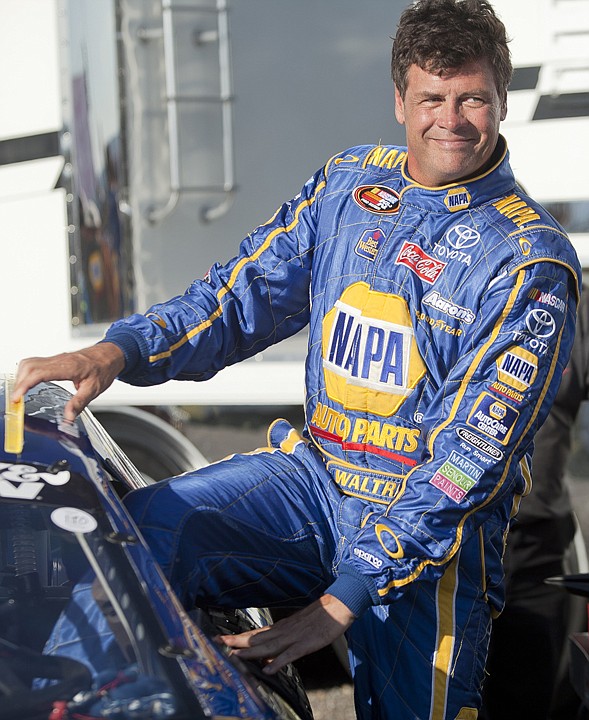 &lt;p&gt;Michael Waltrip climbs into his car before the Toyota/TTC 150 at
Montana Raceway Park Saturday evening.&lt;/p&gt;