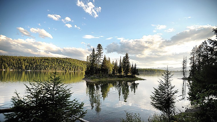 &lt;p&gt;Scattered clouds pass over Holland Lake on Wednesday evening.
The lake can be reached off of Montana 83 in the Swan Valley.&lt;/p&gt;