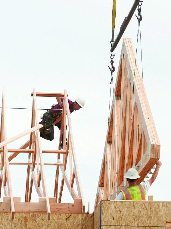 &lt;p&gt;Workers guide a truss into place as it is lowered onto the frame
of the new addition at Buffalo Hill Terrace Thursday morning.&lt;/p&gt;