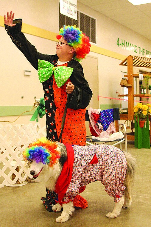 Candice Boutilier/Columbia Basin HeraldJess Darnall, 11, George, clowned around with his border collie-Australian shepherd dog Max during the obstacle course rally Thursday.