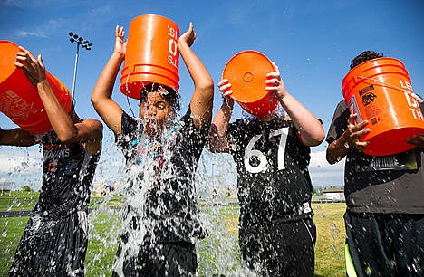 &lt;p&gt;Incoming freshman Gabe Jackson pours a bucket ice water over his head during the Post Falls High School Trojan&#146;s ALS ice bucket challenge to raise awareness for the disease Amyotrophic Lateral Sclerosis (ALS). The Post Falls Trojans challenged Coeur d&#146;Alene High School and Lake City High School to complete the challenge in the next 24 hours.&lt;/p&gt;