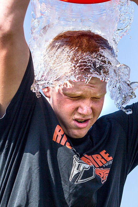 &lt;p&gt;Post Falls High School sophomore Bradley Noesen, 15, leads off his school's football team's ALS ice bucket challenge on Thursday on the Post Falls High School football field. Noesen dedicated the challenge to his father, Morgan, who has ALS.&lt;/p&gt;