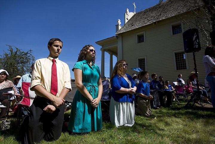 &lt;p&gt;From left, Andrew Shlader, Mary Shlader and Emily Cahill attend mass on Monday, Aug. 15, 2016 at the Tribe's 82nd annual Cataldo Pilgrimage mass at Old Mission State Park. The Catholic mass celebrated the Feast of the Assumption of the Virgin Mary, and featured a coming together of the Catholic religion and Native American culture.&lt;/p&gt;