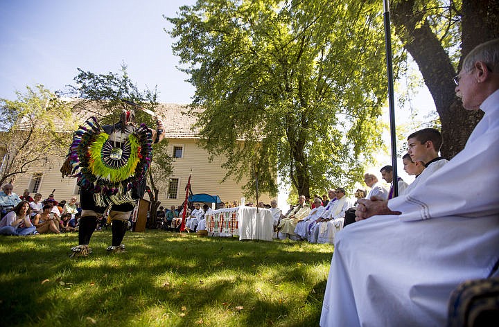 &lt;p&gt;Dresssed in traditional regalia, Coeur d'Alene Tribal Member Andy Kitt performs a Cup Dance on Monday, Aug. 15, 2016 at the Tribe's 82nd annual Cataldo Pilgrimage mass at Old Mission State Park. The Catholic mass celebrated the Feast of the Assumption of the Virgin Mary, and featured a coming together of the Catholic religion and Native American culture. The dance is performed before communion to honor the food from heaven.&lt;/p&gt;