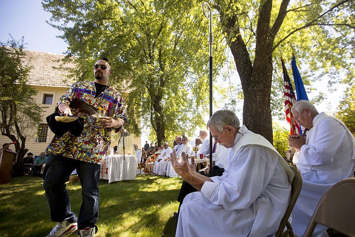 &lt;p&gt;Coeur d'Alene Tribal Member Brandon Cook waves the smoke of a smudge stick over members of the Catholic chuch during an incensing ceremony on Monday, Aug. 15, 2016 at the Tribe's 82nd annual Cataldo Pilgrimage mass at Old Mission State Park. The Catholic mass celebrated the Feast of the Assumption of the Virgin Mary, and featured a coming together of the Catholic religion and Native American culture.&lt;/p&gt;