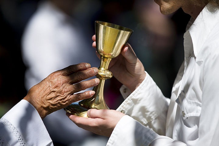 &lt;p&gt;A Cataldo Pilgrimage mass attendee, right, accepts communion from a priest on Monday, Aug. 15, 2016 at the Coeur d'Alene Tribe's 82nd annual Cataldo Pilgrimage mass at Old Mission State Park. The Catholic mass celebrated the Feast of the Assumption of the Virgin Mary, and featured a coming together of the Catholic religion and Native American culture.&lt;/p&gt;