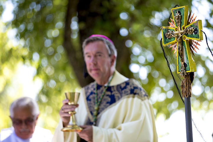 &lt;p&gt;Diocese of Boise Bishop Peter Christiensen begins communion on Monday, Aug. 15, 2016 at the Coeur d'Alene Tribe's 82nd annual Cataldo Pilgrimage mass at Old Mission State Park. The Catholic mass celebrated the Feast of the Assumption of the Virgin Mary, and featured a coming together of the Catholic religion and Native American culture.&lt;/p&gt;