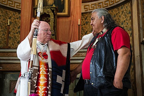 &lt;p&gt;Bishop Mike Driscoll accepts a gift from Calvin Nomee during Bishop Mike Driscoll&#146;s last time presiding over Mass at the Caltado Pilgrimage on Friday Morning. Bishop Mike Driscoll has been presiding over mass at the Caltado Pilgrimage for 15 years.&lt;/p&gt;