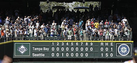 &lt;p&gt;Fans cheer above the scoreboard at Safeco Field after Seattle Mariners pitcher Felix Hernandez threw a perfect game in a 1-0 win over the Tampa Bay Rays in a baseball game, Wednesday, Aug. 15, 2012, in Seattle. (AP Photo/Ted S. Warren)&lt;/p&gt;