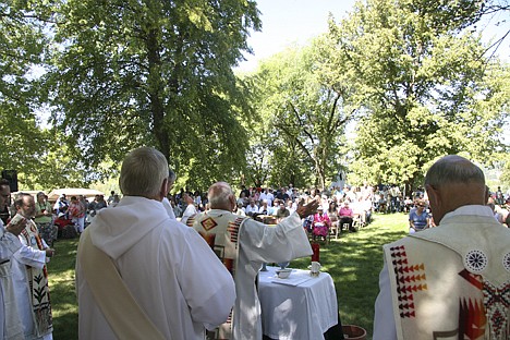 &lt;p&gt;Bishop Michael Driscoll, of the Roman Catholic Diocese of Boise, holds his hands out to the audience during the Sunday mass held at the Cataldo Mission during the Feast of Assumption event.&lt;/p&gt;