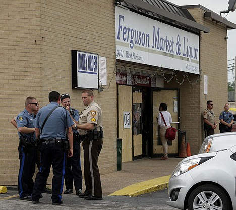 &lt;p&gt;Law enforcement officers stand watch outside a market, Friday where Michael Brown allegedly stole some cigars before being killed by police nearly a week ago in Ferguson, Mo. Law enforcement officers stand watch outside a market, Friday where Michael Brown allegedly stole some cigars before being killed by police nearly a week ago in Ferguson, Mo.&lt;/p&gt;