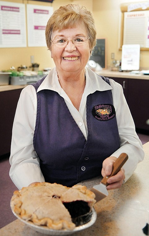 Erna Fortin with one of the Huckleberry Patch's famous pies. They sold 816 pies in July, and this month they have already sold more than 300.