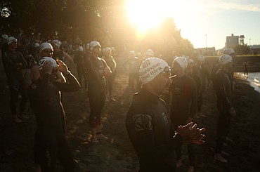 <p>LOREN BENOIT/Press Athletes swim in the waters of Lake Coeur d'Alene, bike downtown and run along the Centennial Trail during the Coeur d'Alene Triathlon on Saturday, August 13, 2016.</p>