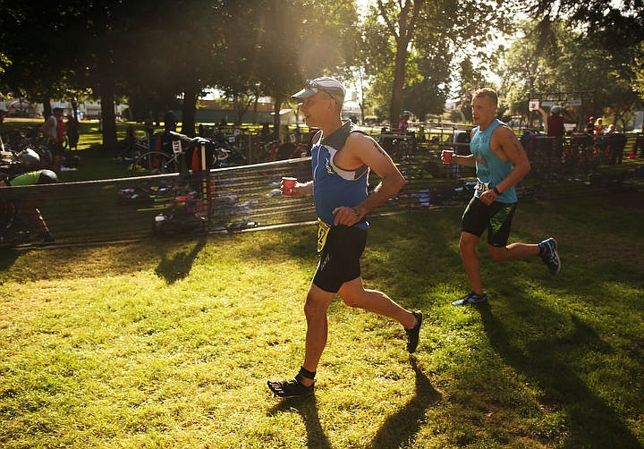 &lt;p&gt;LOREN BENOIT/Press Athletes swim in the waters of Lake Coeur d'Alene, bike downtown and run along the Centennial Trail during the Coeur d'Alene Triathlon on Saturday, August 13, 2016.&lt;/p&gt;