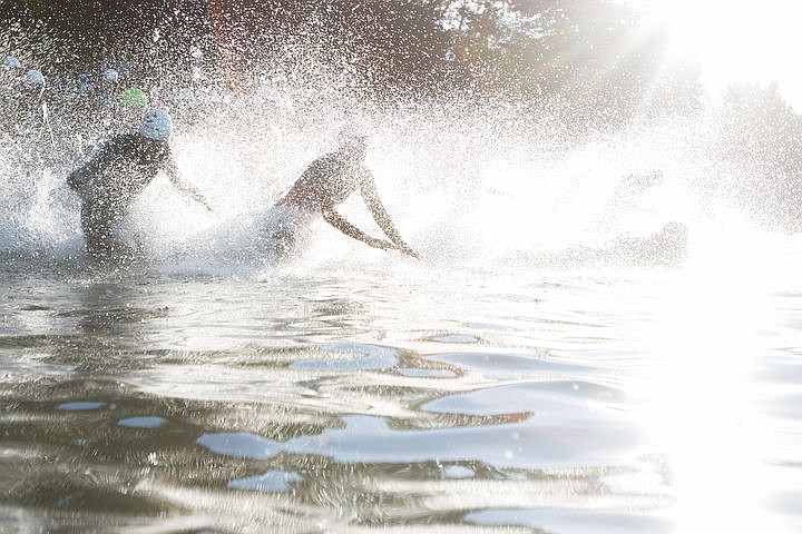 &lt;p&gt;BETHANY BLITZ/Press Athletes swim in the waters of Lake Coeur d'Alene, bike downtown and run along the Centennial Trail during the Coeur d'Alene Triathlon on Saturday, August 13, 2016.&lt;/p&gt;