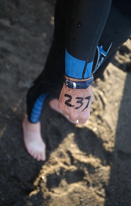 <p>LOREN BENOIT/Press Athletes swim in the waters of Lake Coeur d'Alene, bike downtown and run along the Centennial Trail during the Coeur d'Alene Triathlon on Saturday, August 13, 2016.</p>