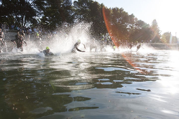 &lt;p&gt;BETHANY BLITZ/Press Athletes swim in the waters of Lake Coeur d'Alene, bike downtown and run along the Centennial Trail during the Coeur d'Alene Triathlon on Saturday, August 13, 2016.&lt;/p&gt;