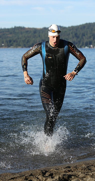 <p>LOREN BENOIT/Press Athletes swim in the waters of Lake Coeur d'Alene, bike downtown and run along the Centennial Trail during the Coeur d'Alene Triathlon on Saturday, August 13, 2016.</p>