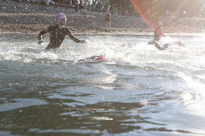 &lt;p&gt;BETHANY BLITZ/Press Athletes swim in the waters of Lake Coeur d'Alene, bike downtown and run along the Centennial Trail during the Coeur d'Alene Triathlon on Saturday, August 13, 2016.&lt;/p&gt;