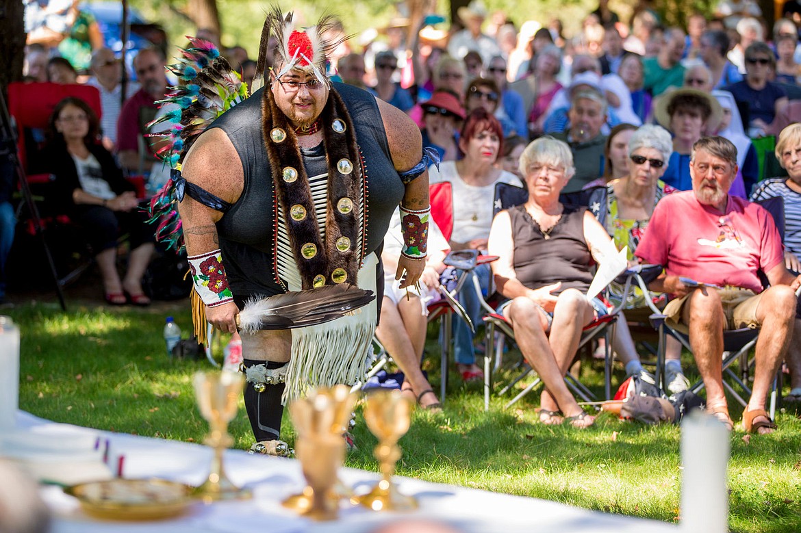 &lt;p&gt;Dressed in traditional regalia, Coeur d'Alene Tribal Member Andy Kitt performs a Cup Dance on Monday at the Tribe's annual Cataldo Pilgrimage mass at Old Mission State Park. The dance is performed before communion to honor the food from heaven.&lt;/p&gt;