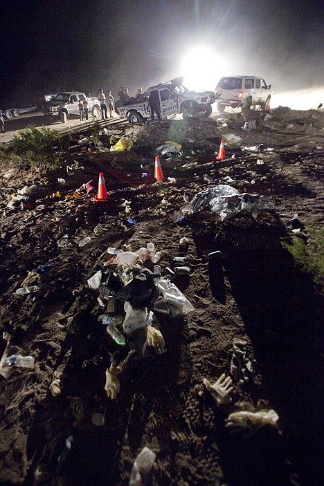 &lt;p&gt;Debris from the scene of an accident litters the ground Sunday where an off-road race truck, background, went out of control and plowed into a crowd of spectators during a race in Lucerne Valley, Calif., on Saturday. At least eight people were killed and 12 wounded during the incident about 100 miles east of Los Angeles.&lt;/p&gt;