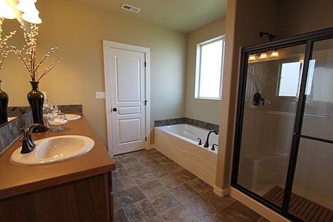 &lt;p&gt;The spacious and private master suite boasts a dual vanity bathroom, optional separate shower and enormous closet.&lt;/p&gt;