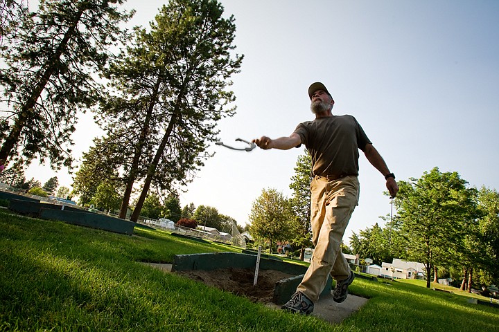 &lt;p&gt;Ethan Holcomb, of Coeur d'Alene, who has been playing horseshoes for nearly 35 years, releases his shoe during a weekly meeting of the local horseshoe club.&lt;/p&gt;