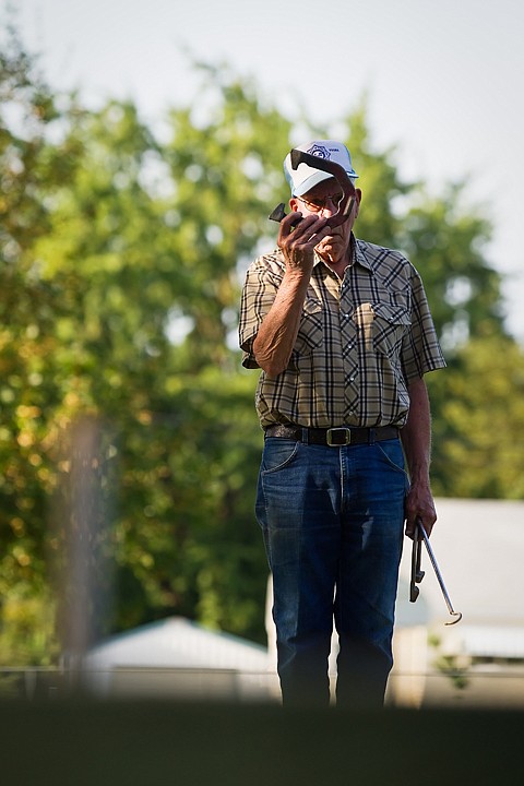 &lt;p&gt;Ike Bews, of Post Falls, eyes his target Monday during a weekly practice of the City of Coeur d'Alene and Kootenai County Horseshoe Pitchers Association at Winton Park in Coeur d'Alene.&lt;/p&gt;