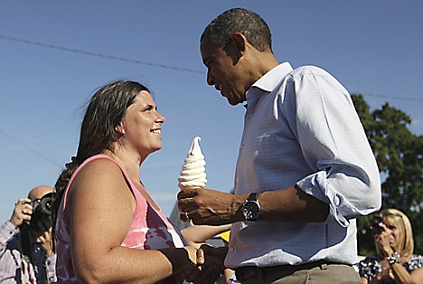 &lt;p&gt;President Barack Obama holds a soft serve ice cream cone and shakes hands during his visit to DeWitt Dairy Treats, Tuesday, Aug. 16, 2011, in DeWitt, Iowa, during his three-day economic bus tour. (AP Photo/Carolyn Kaster)&lt;/p&gt;