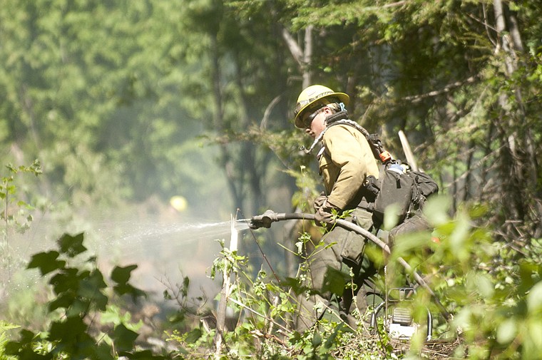 &lt;p&gt;A firefighter works on the South Fork Lost Creek Fire.&lt;/p&gt;