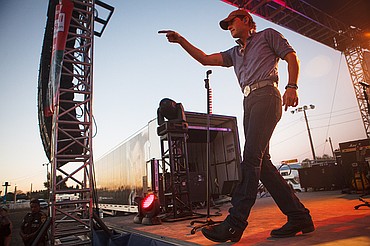 <p>Patrick Cote/Daily Inter Lake Rodney Atkins gestures to the crowd Wednesday night during his concert at the Northwest Montana Fair. Wednesday, Aug. 15, 2012 in Kalispell, Montana.</p>